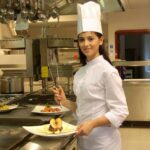 Female cook in the kitchen of a restaurant